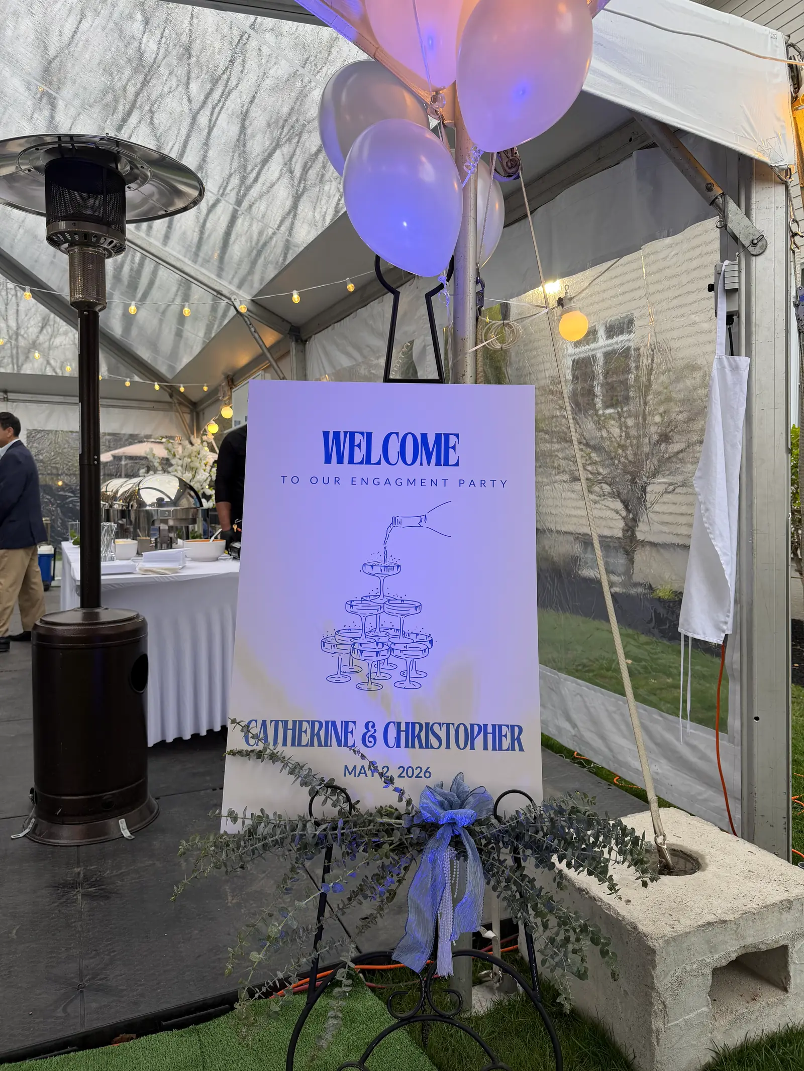 Hand-lettered welcome sign and balloons greeting guests at an SKG celebration